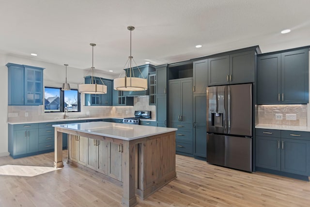 7284 205th St W, Faribault, MN 55021 - kitchen with backsplash, recessed lighting, appliances with stainless steel finishes, and light wood-style flooring