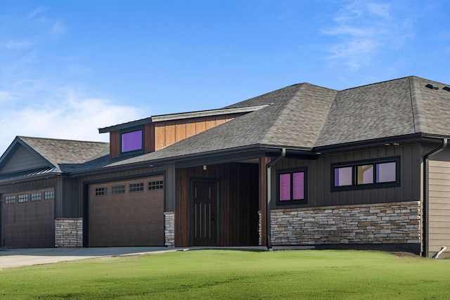 7284 205th St W, Faribault, MN 55021 - view of front facade with board and batten siding, an attached garage, and stone siding
