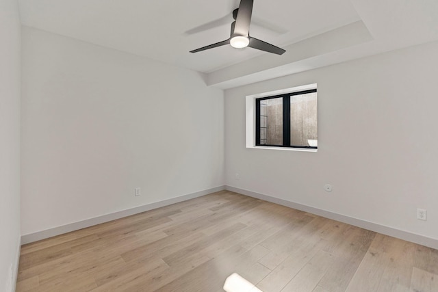 7284 205th St W, Faribault, MN 55021 - empty room with light wood-type flooring, a ceiling fan, and baseboards