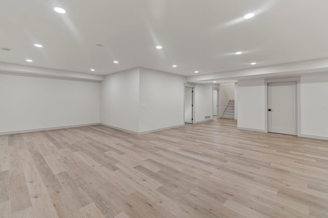 7284 205th St W, Faribault, MN 55021 - finished basement featuring baseboards, stairs, light wood finished floors, and recessed lighting