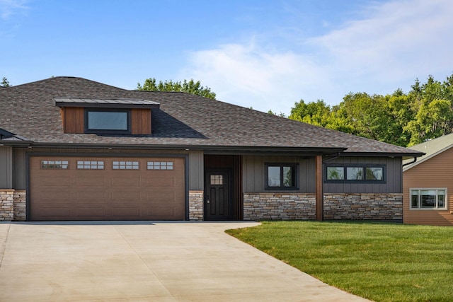 7284 205th St W, Faribault, MN 55021 - view of front of house featuring stone siding, driveway, a front lawn, board and batten siding, and a garage