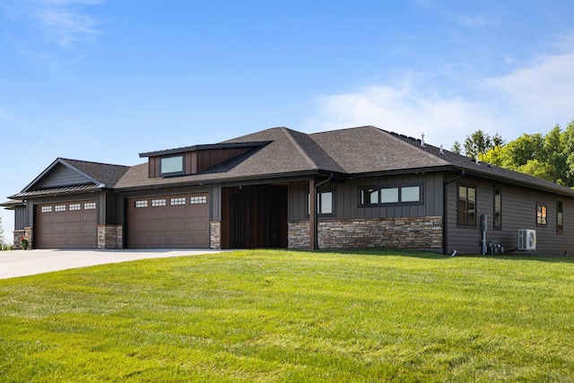 7284 205th St W, Faribault, MN 55021 - view of front of property with an attached garage, stone siding, a front lawn, board and batten siding, and driveway