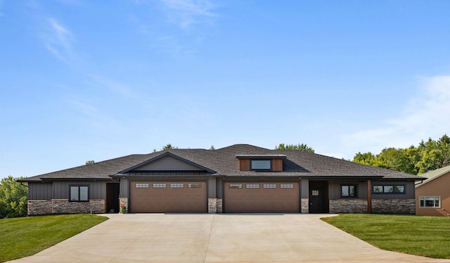 7284 205th St W, Faribault, MN 55021 - prairie-style house with stone siding, driveway, an attached garage, and a front lawn