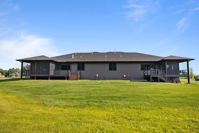 7284 205th St W, Faribault, MN 55021 - back of house featuring a sunroom, stairs, and a lawn