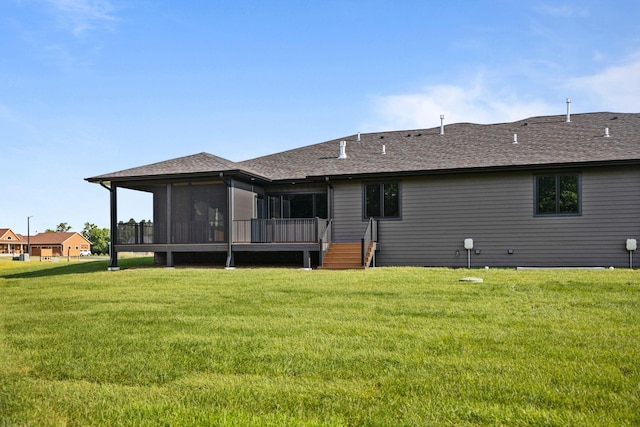 7284 205th St W, Faribault, MN 55021 - rear view of house featuring a sunroom, a yard, and a shingled roof