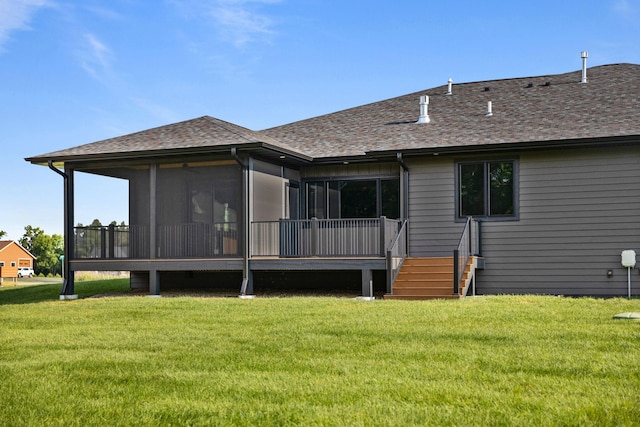 7284 205th St W, Faribault, MN 55021 - back of house with a yard, a sunroom, roof with shingles, and a deck