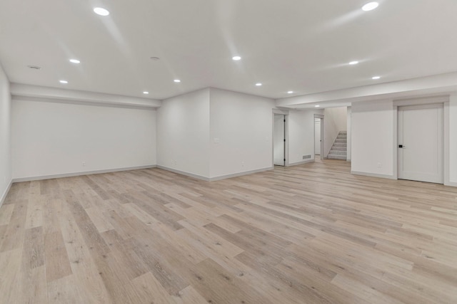 7284 205th St W, Faribault, MN 55021 - finished below grade area with recessed lighting, light wood-style floors, and stairs