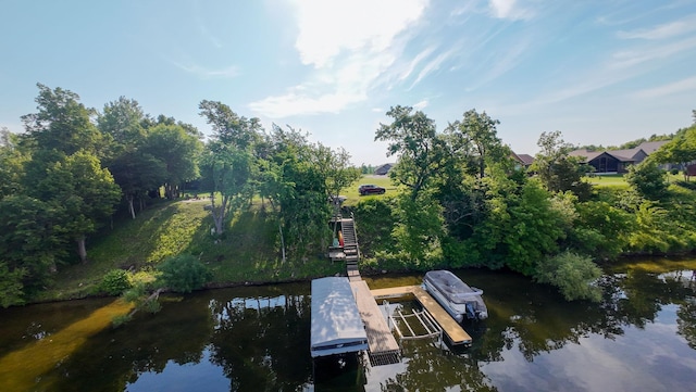 7284 205th St W, Faribault, MN 55021 - dock featuring a water view, boat lift, and view of scattered trees