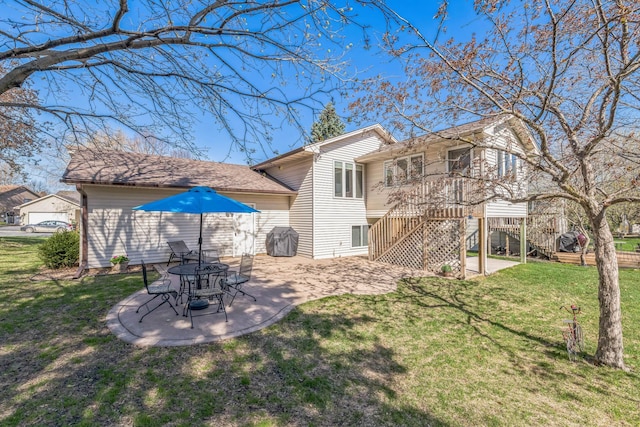 rear view of house featuring a patio area, a yard, and stairway