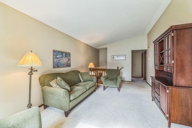 living room featuring light colored carpet and lofted ceiling