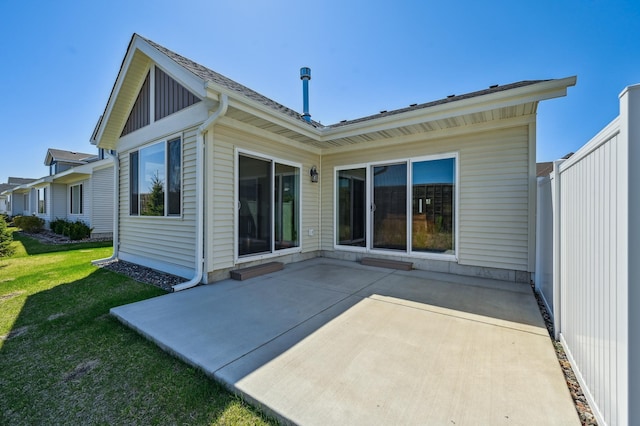 4922 93rd Way N, Brooklyn Park, MN 55443 - rear view of property with a patio and a yard