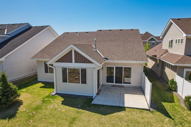 4922 93rd Way N, Brooklyn Park, MN 55443 - back of house featuring board and batten siding, a patio area, and roof with shingles