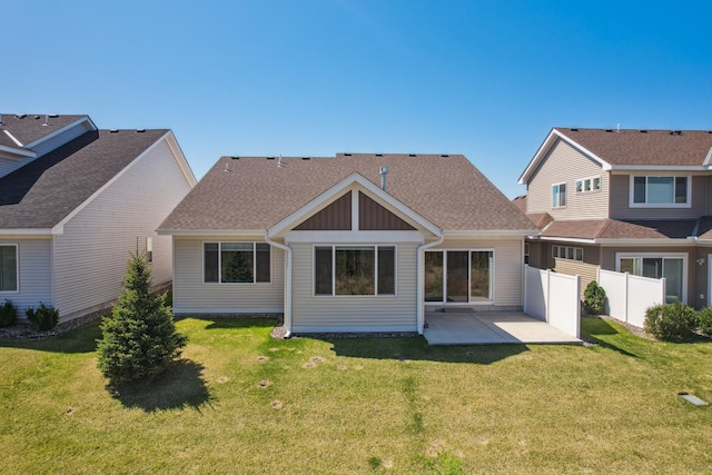4922 93rd Way N, Brooklyn Park, MN 55443 - back of property featuring a patio, board and batten siding, and roof with shingles