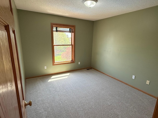 937 Briar Glen Ln, Woodbury, MN 55129 - carpeted spare room with a textured ceiling and baseboards