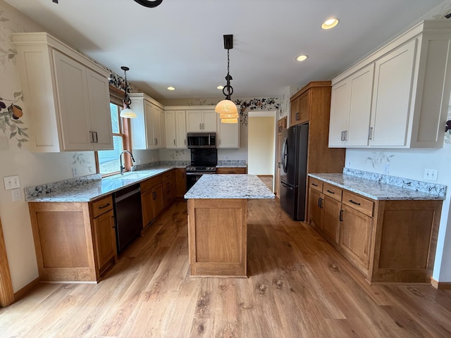 937 Briar Glen Ln, Woodbury, MN 55129 - kitchen featuring appliances with stainless steel finishes, a sink, light wood-type flooring, a center island, and light stone countertops