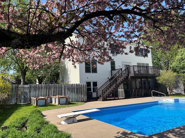 937 Briar Glen Ln, Woodbury, MN 55129 - view of swimming pool featuring stairs, a diving board, fence, and a deck