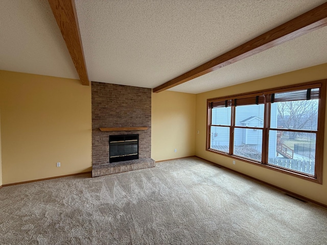 937 Briar Glen Ln, Woodbury, MN 55129 - unfurnished living room featuring carpet, beam ceiling, a brick fireplace, a textured ceiling, and baseboards