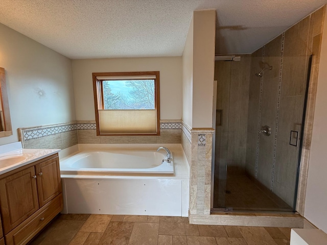 937 Briar Glen Ln, Woodbury, MN 55129 - full bath with a stall shower, a garden tub, vanity, a textured ceiling, and tile walls