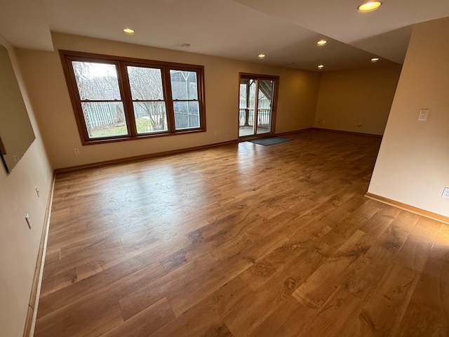 937 Briar Glen Ln, Woodbury, MN 55129 - empty room with wood finished floors, baseboards, and recessed lighting
