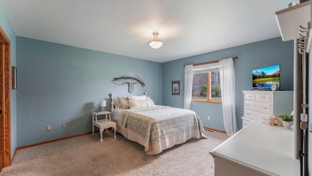 bedroom featuring baseboards and carpet floors