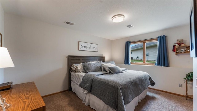 bedroom with carpet floors, baseboards, and visible vents