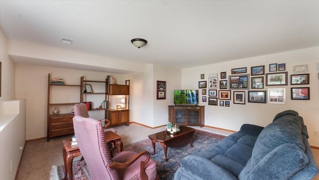 living room with baseboards and carpet flooring