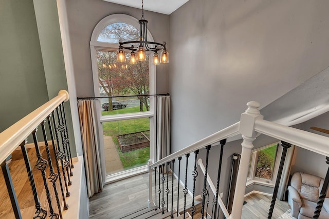 interior space with wood finished floors and a chandelier