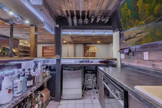 interior space featuring light tile patterned floors and a sink