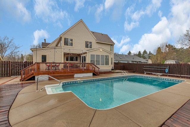 view of pool with a patio, a fenced backyard, a deck, and a fenced in pool
