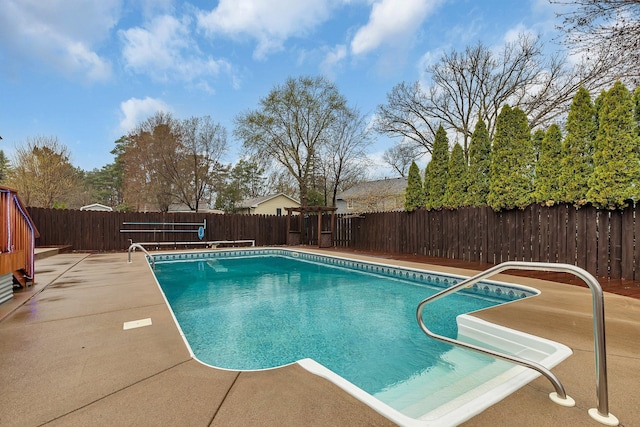 view of swimming pool featuring a fenced backyard, a fenced in pool, and a patio area