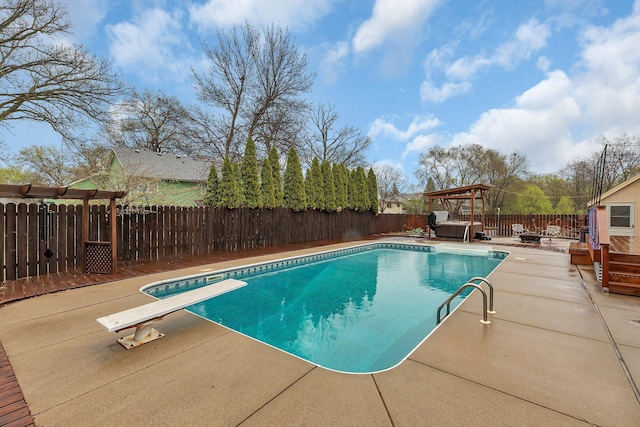 view of pool featuring a deck, a patio area, a fenced in pool, a fenced backyard, and a pergola