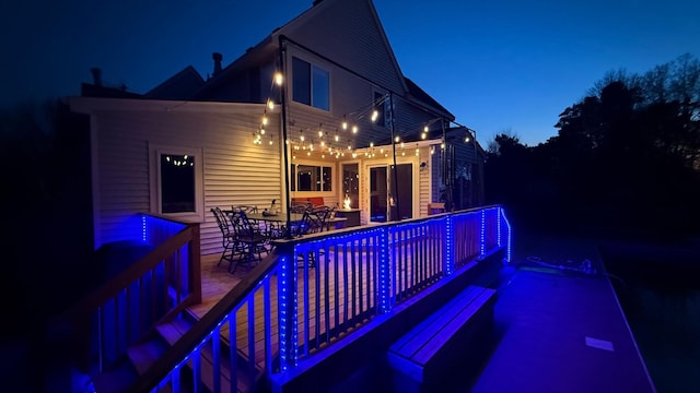 exterior space featuring outdoor dining space and an outdoor pool