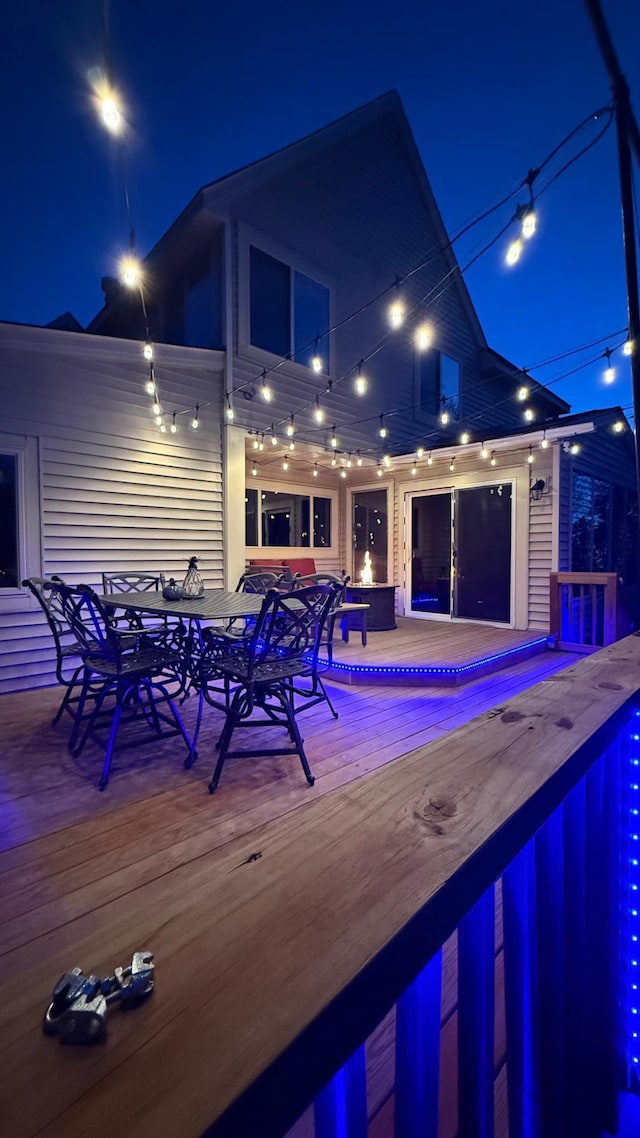 exterior space with outdoor dining area and an outdoor pool