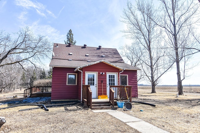 11287 135th Ave NE, Thief River Falls, MN 56701 - view of front of house with roof with shingles and a deck