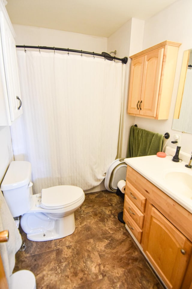 11287 135th Ave NE, Thief River Falls, MN 56701 - bathroom featuring toilet, curtained shower, and vanity