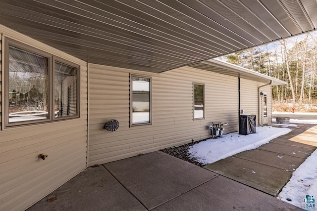 view of side of home featuring a patio area