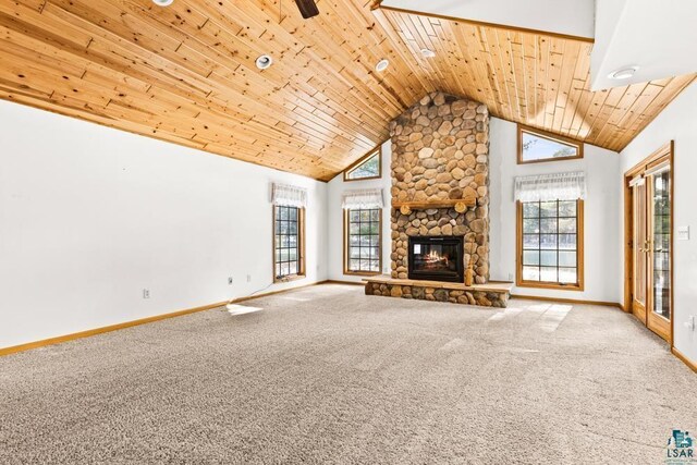 unfurnished living room featuring a fireplace, carpet flooring, wood ceiling, and baseboards