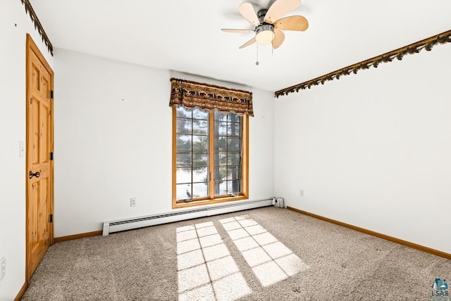 carpeted spare room with ceiling fan, baseboards, and baseboard heating
