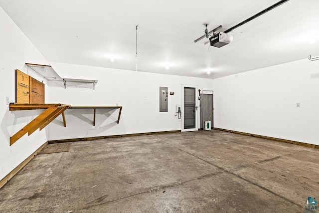 garage featuring electric panel, baseboards, and a garage door opener
