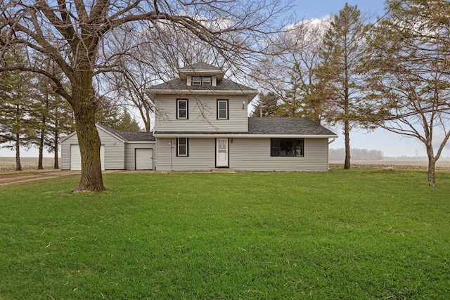 exterior space featuring a front yard, driveway, and roof with shingles