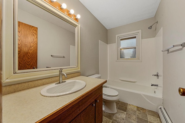 bathroom with baseboard heating, toilet, vanity, and washtub / shower combination