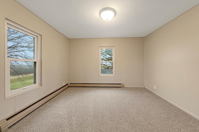 carpeted empty room featuring a baseboard heating unit, baseboards, and a baseboard radiator