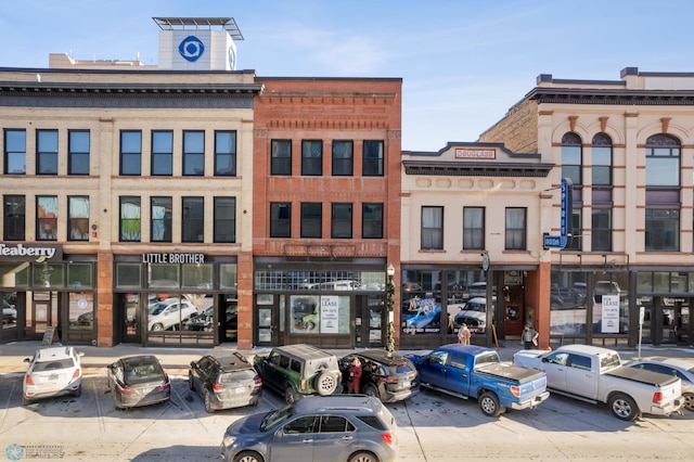 view of property with uncovered parking