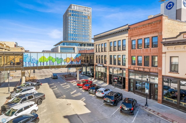 view of building exterior featuring uncovered parking