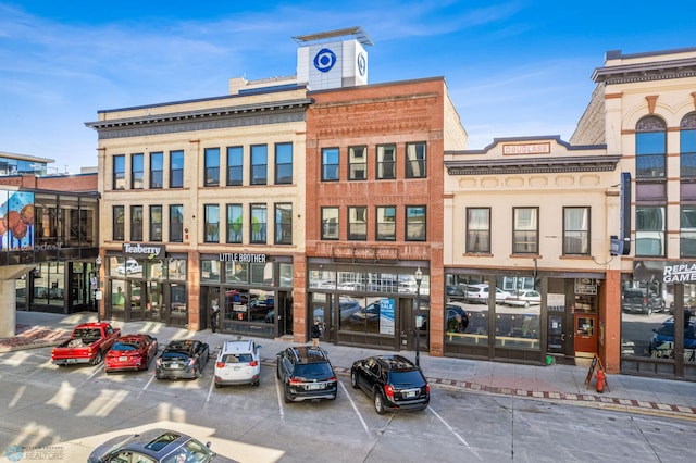 view of property featuring uncovered parking