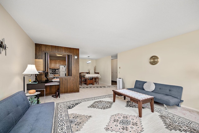 living area featuring light colored carpet