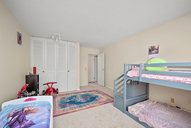 carpeted bedroom with a closet