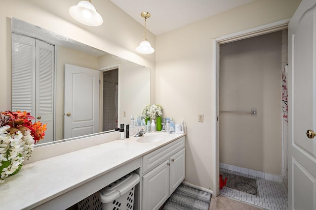 bathroom featuring vanity and baseboards