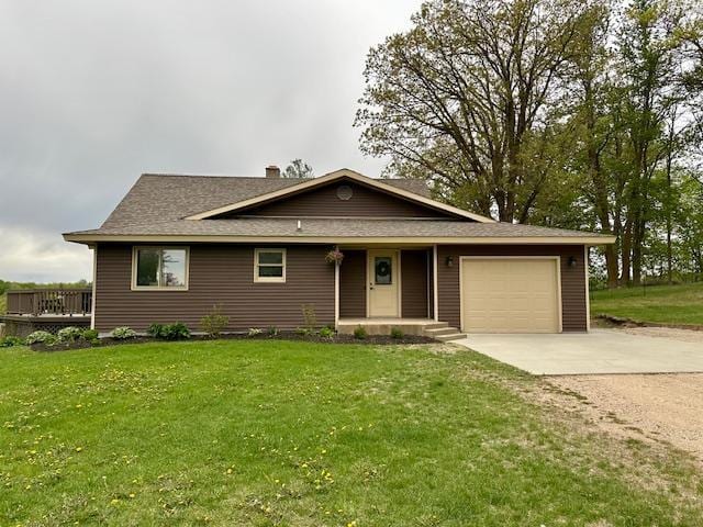 12787 Lumberjack Rd NW, Shevlin, MN 56676 - view of front of home featuring concrete driveway, an attached garage, a front lawn, and a porch