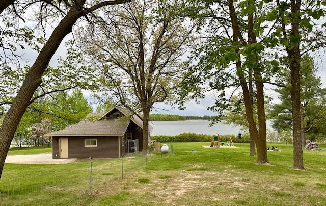 12787 Lumberjack Rd NW, Shevlin, MN 56676 - view of green lawn featuring a playground and a water view